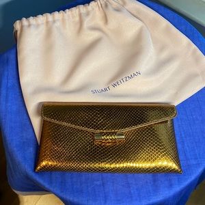 Stuart Weitzman clutch. Perfect condition. It is more rose gold than gold